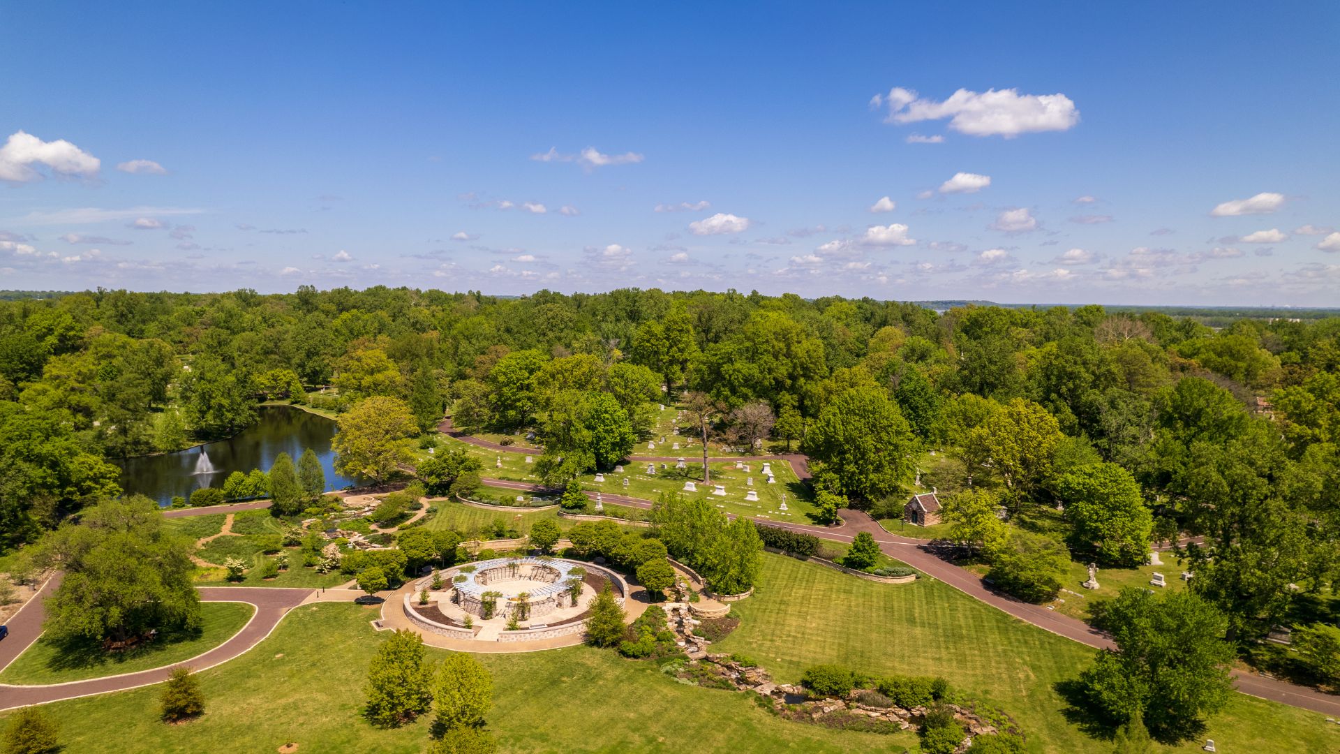 A drone shot shows the expansive greenery of Bellefontaine Cemetery and Arboretum in St Louis.