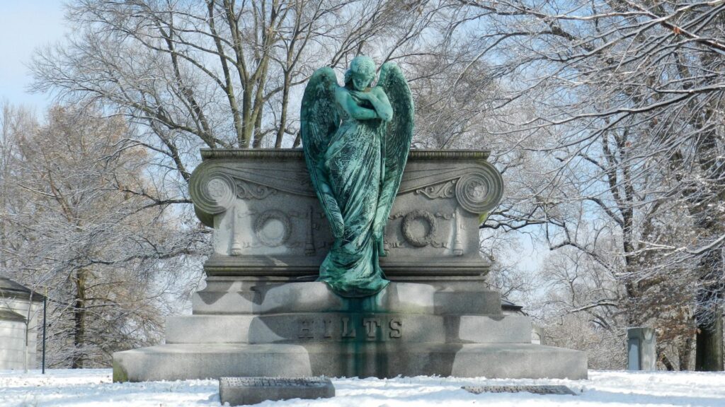 A fresh coat of snow covers a monument at Bellefontaine Cemetery and Arboretum.