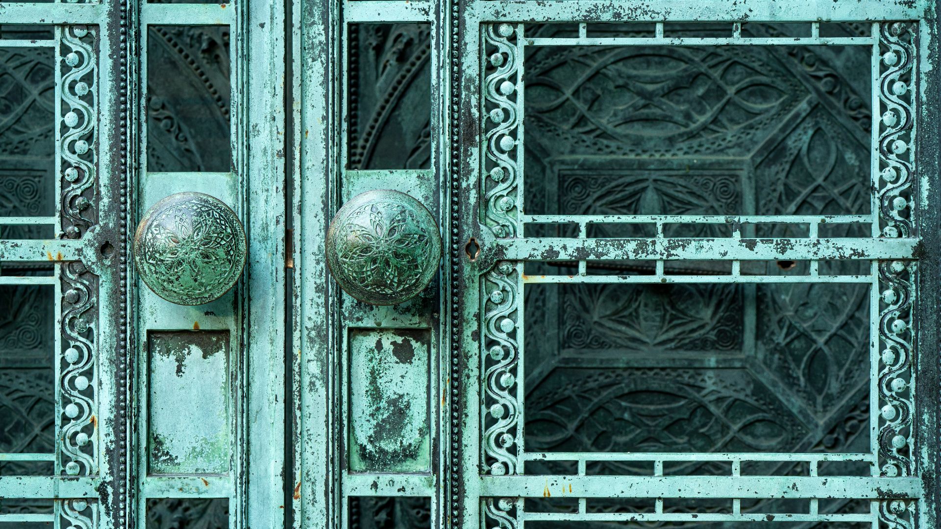 Detailed iron doors mark the entrance to the Wainwright Tomb.