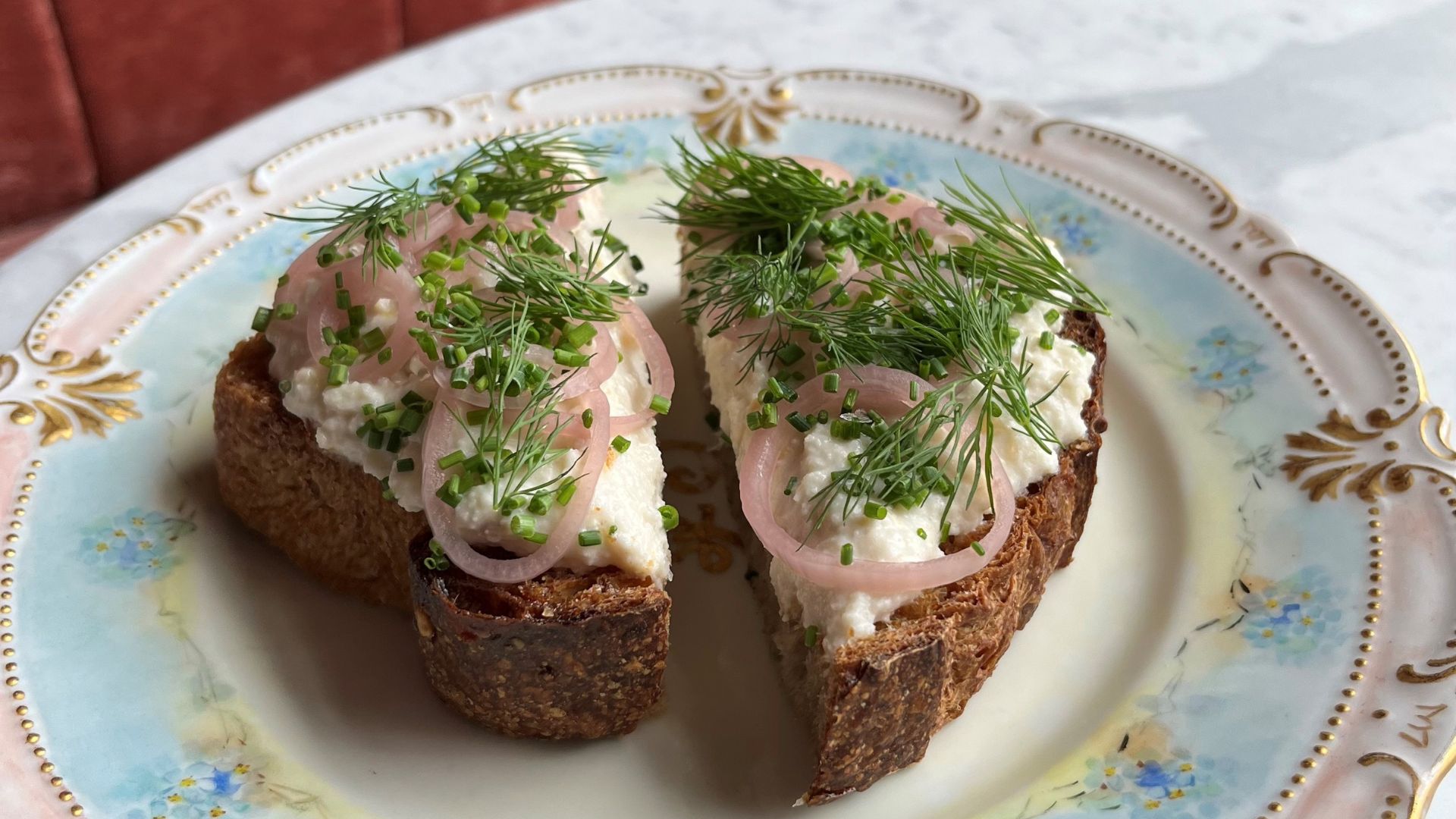Smoked trout rillette toast with whipped trout mousse served on toasted sourdough porridge bread from Winslow’s Table and topped with pickled shallots, dill and chives.
