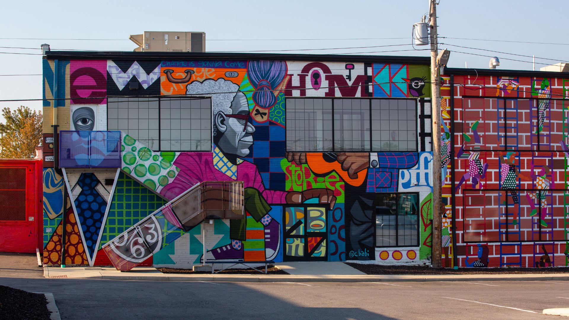 A vibrant mural by Cbabi Bayoc welcomes guests to The Walls Off Washington.
