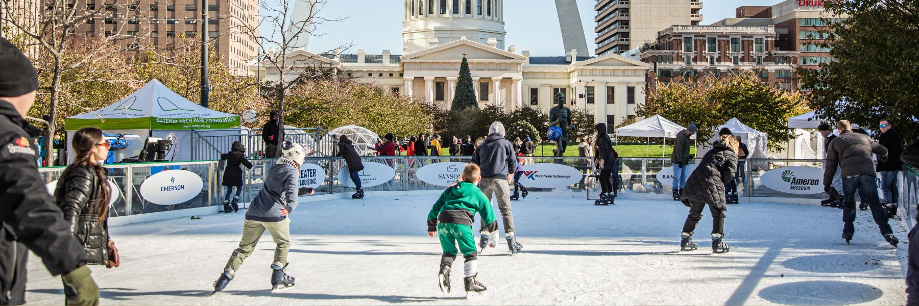 Families skate on the ice rink in downtown St. Louis during Winterfest.