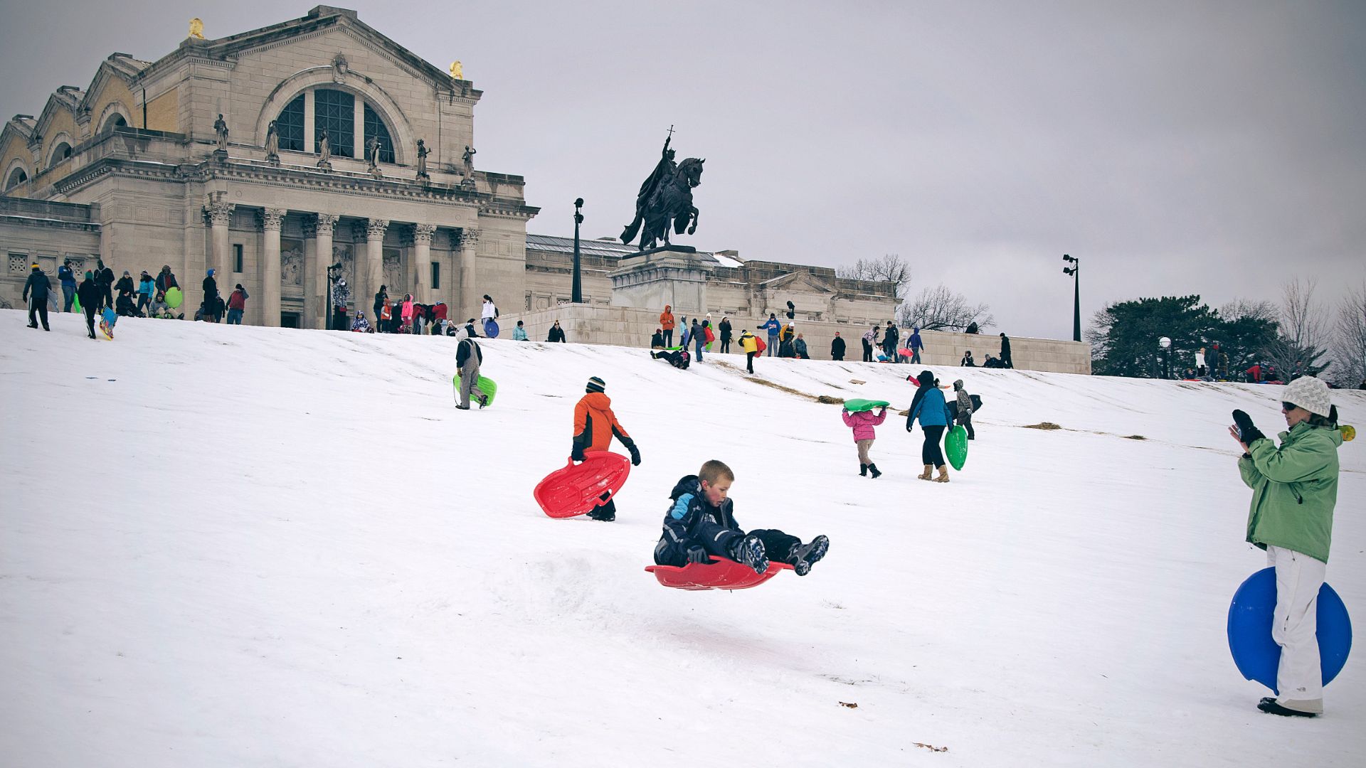 During winter in St. Louis, people sled down Art Hill in Forest Park.