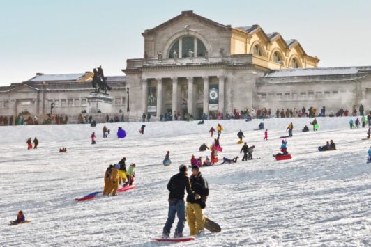To make the most of winter in St. Louis, people sled down Art Hill in Forest Park.