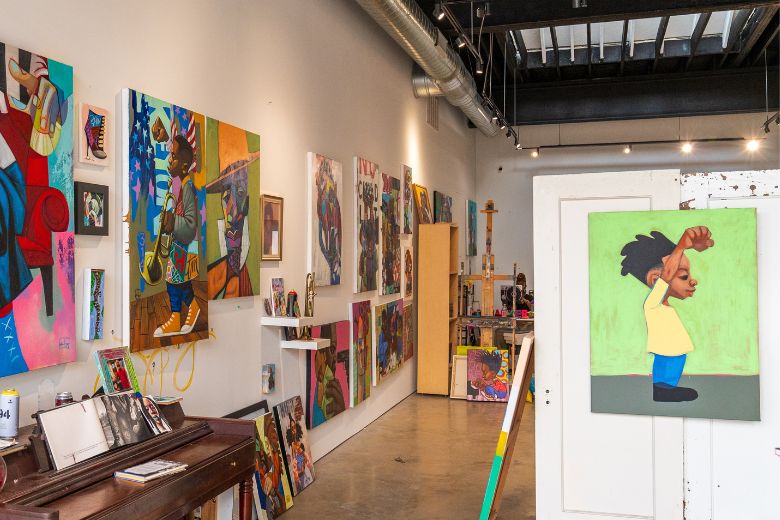 At Cbabi Bayoc's art studio in Grand Center, you can see paintings with his colorful, cartoonish style.