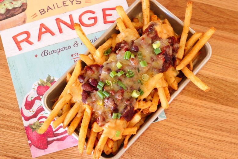 Baileys’ Range serves fries with beer cheese, brisket chili, Cheddar cheese and green onion.