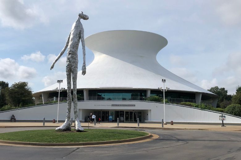 The James S. McDonnell Planetarium has a hyperbolic, thin-shell concrete roof, which flares out at its base to cover a glass-enclosed exhibition area and perimeter porch.