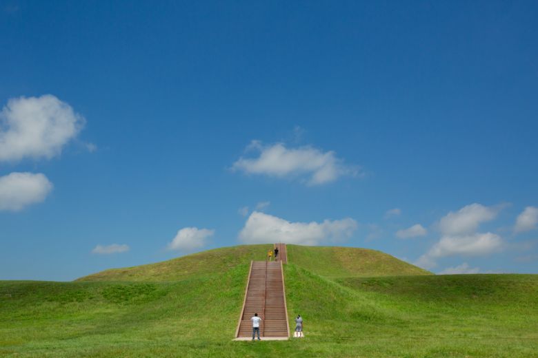 People climb Monks Mound at Cahokia Mounds State Historic Site.