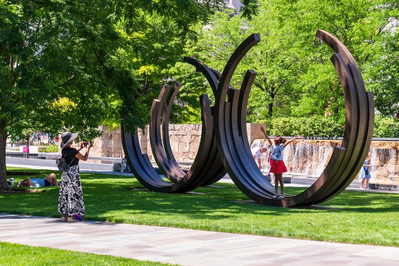 People enjoy the different elements of Citygarden in downtown St. Louis.