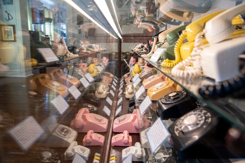 Colorful rotary phones line the shelves of the Jefferson Barracks Telephone Museum.
