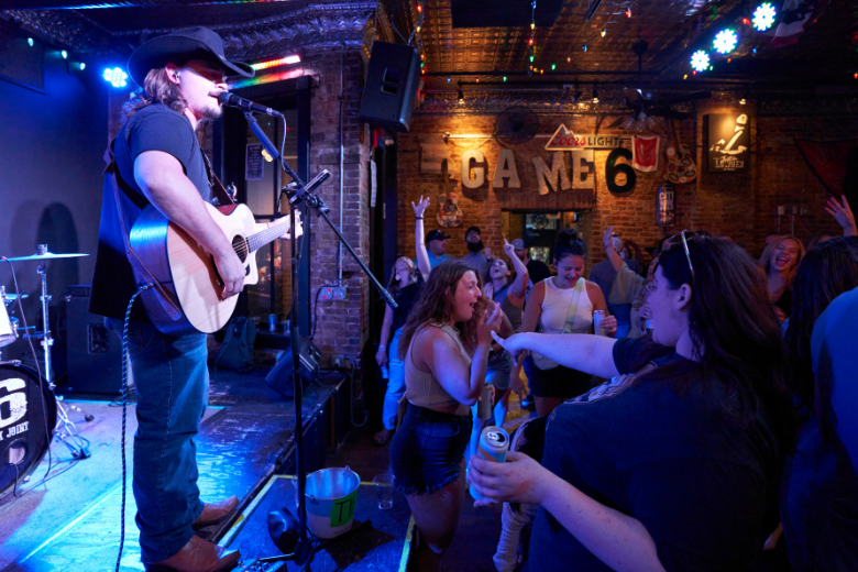 Crowds dance to live country music at The Honky Tonk in downtown St. Louis.