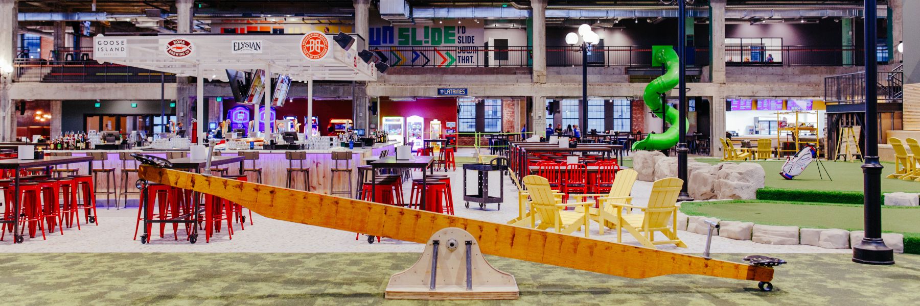 Armory STL, a new entertainment district, offers everything from adult seesaws to cold drinks.