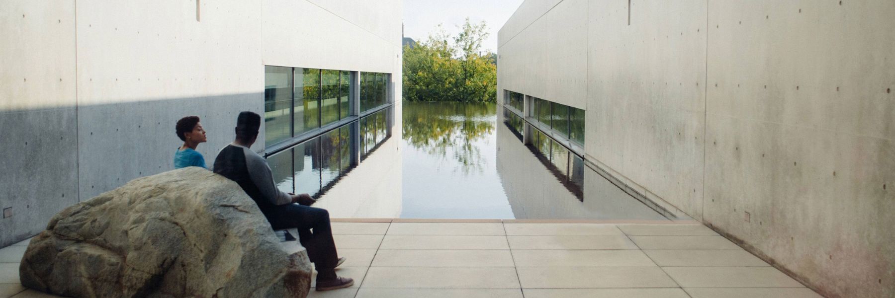 A couple overlooks the reflecting pool at the Pulitzer Arts Foundation.