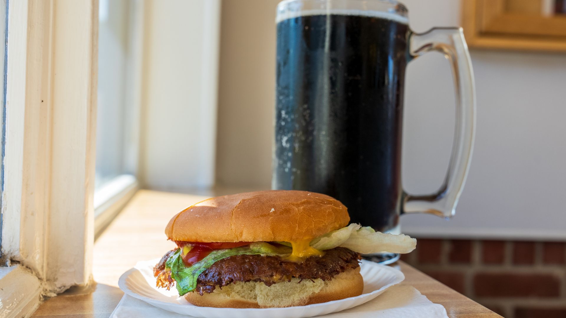 Carl's Drive-In serves griddle-smashed double cheeseburgers and huge mugs of root beer along Route 66.