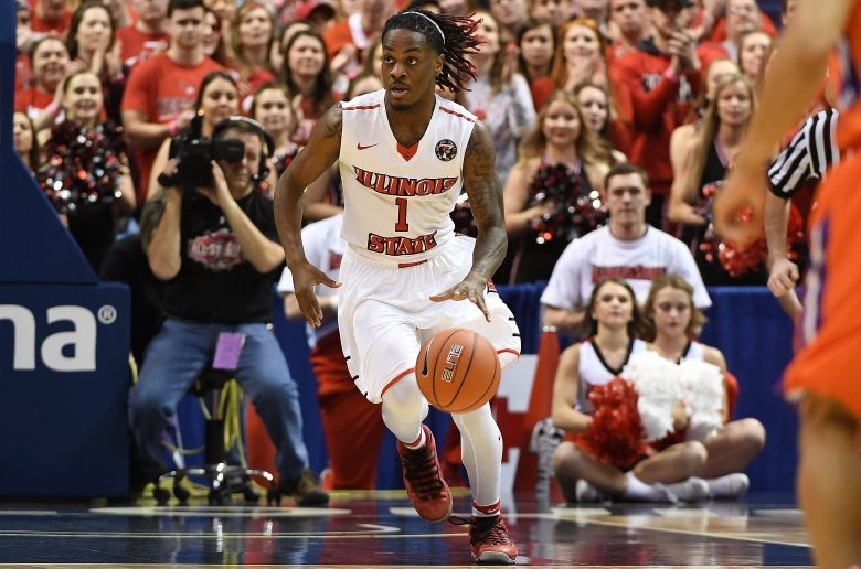 A player dribbles up court during the State Farm Missouri Valley Conference Men's Basketball Tournament in St. Louis