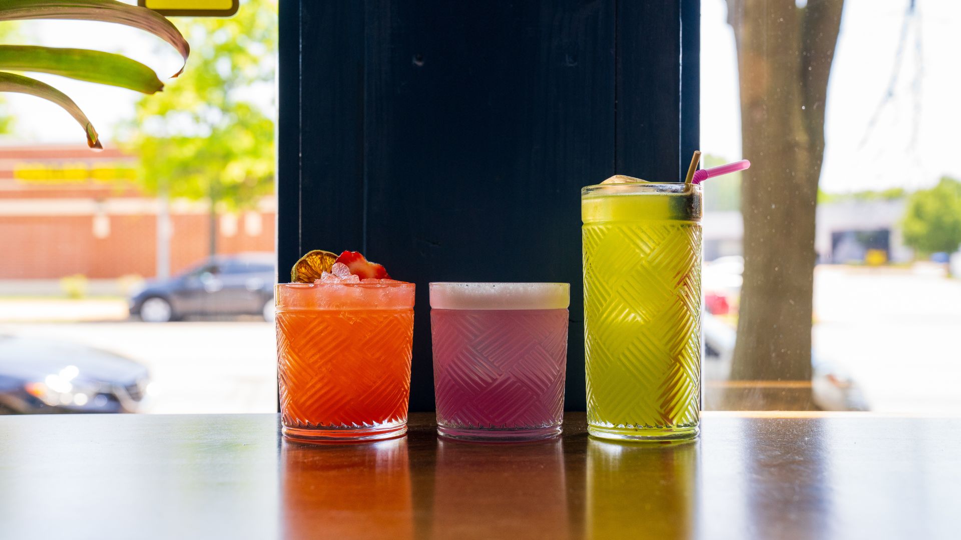 Press serves draft cocktails in colorful glasses in St. Louis.