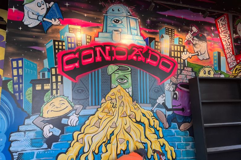 Psychedelic murals brighten the walls of Condado Tacos in Ballpark Village.