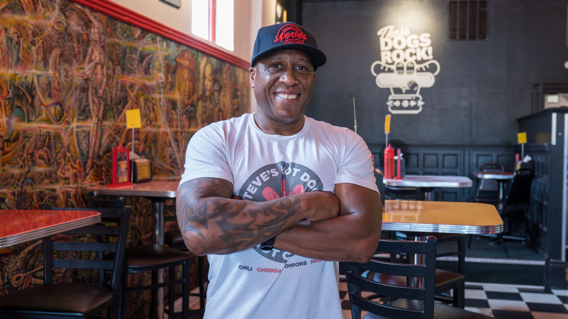 Steve Ewing, owner of Steve's Hot Dogs, poses in his restaurant on South Grand.