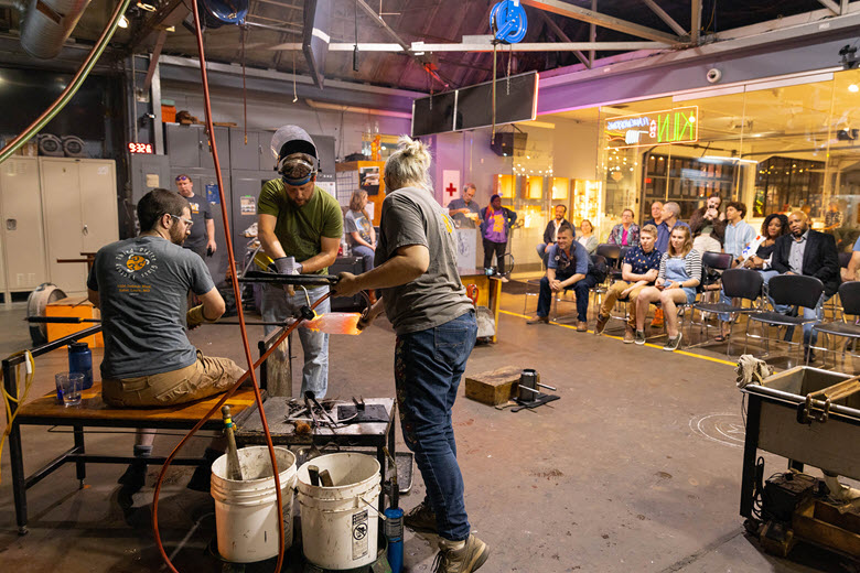 Artists give a glass blowing demonstration during Third Friday at Third Degree Glass Factory.