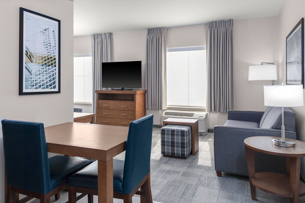 The living room area of a suite at Homewood Suites by Hilton St. Louis Galleria.
