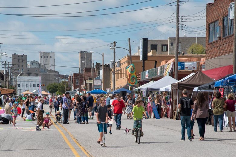 Festival goers in the streets of Alton during the Mississippi Earthtones Festival.