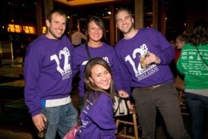 A group poses during 12 Bars of Charity in St. Louis.