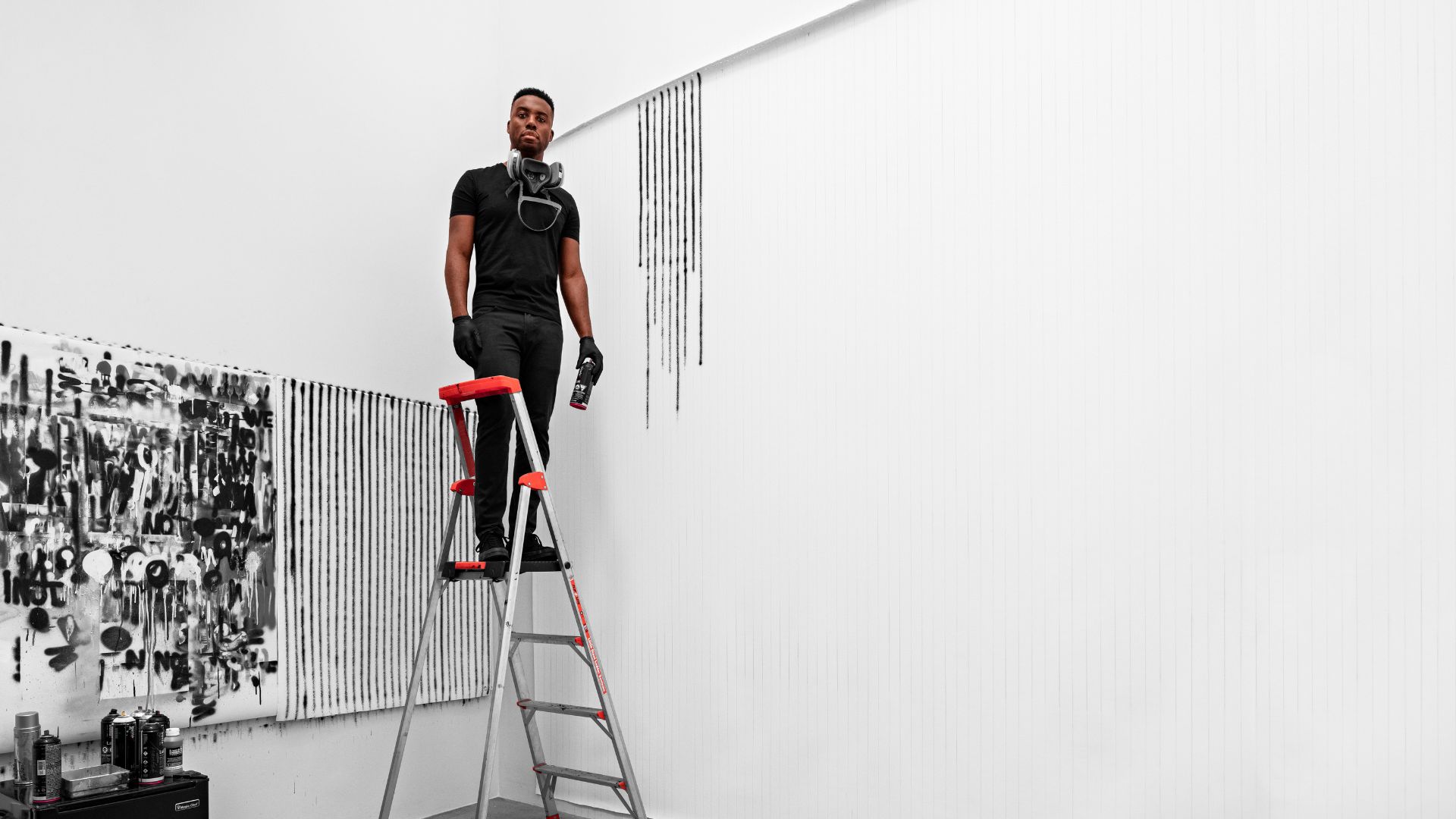 Adam Pendleton poses during the installation of his solo exhibition at the Mildred Lane Kemper Art Museum.