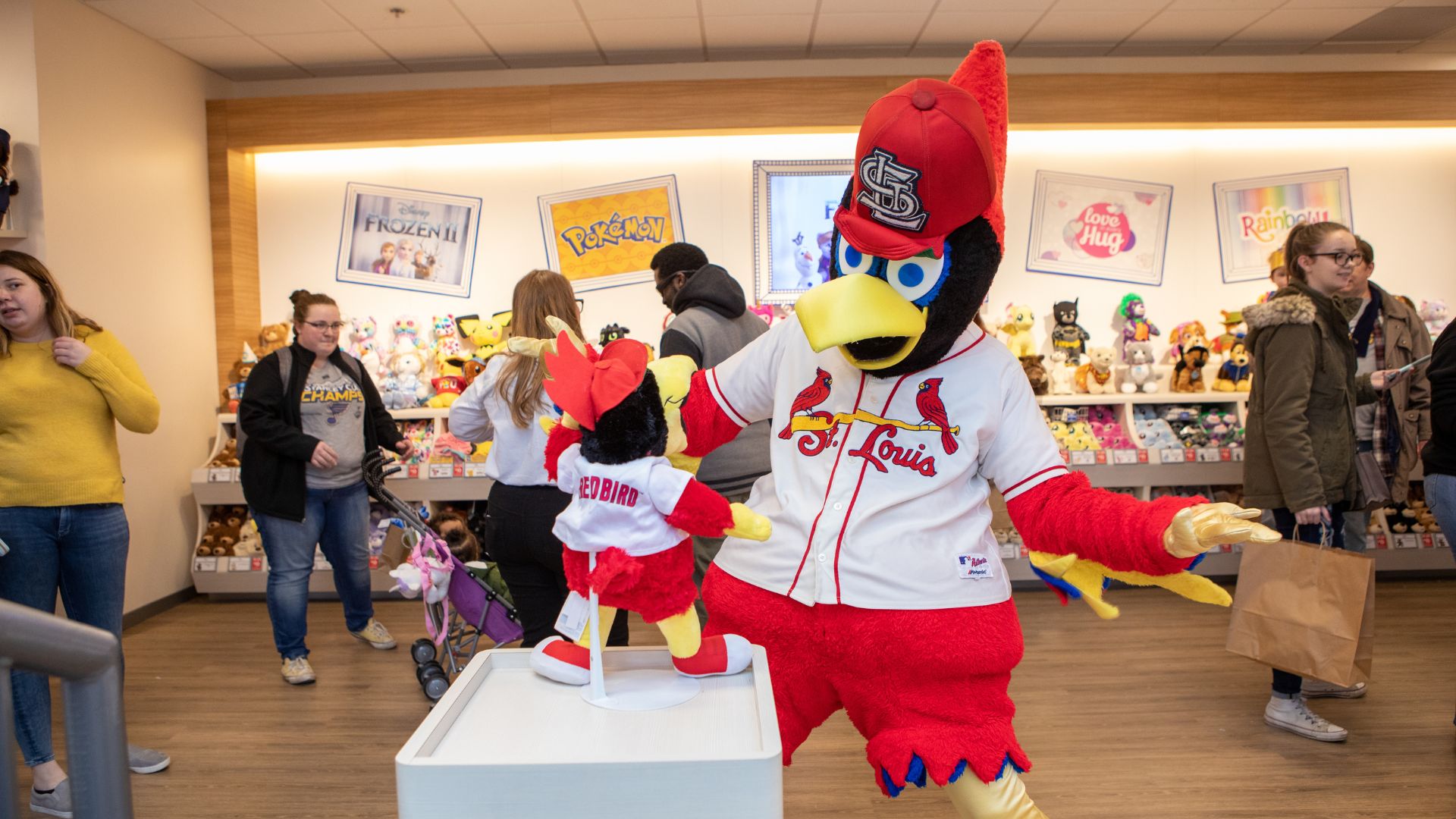 Fredbird sees the stuffed animal version of himself at Build-A-Bear Workshop.