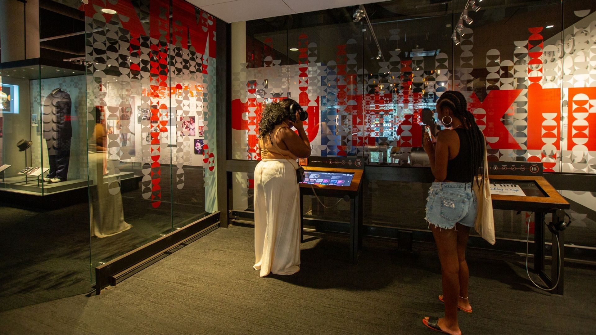 Two visitors create their own blues song at the National Blues Museum.