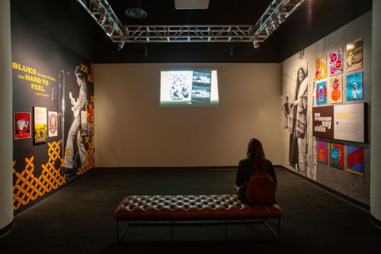 A woman watches a video at the National Blues Museum.