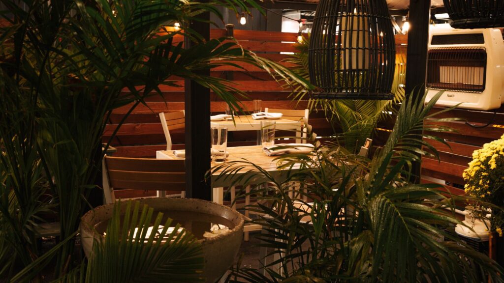 The patio at Indo features lush greenery.