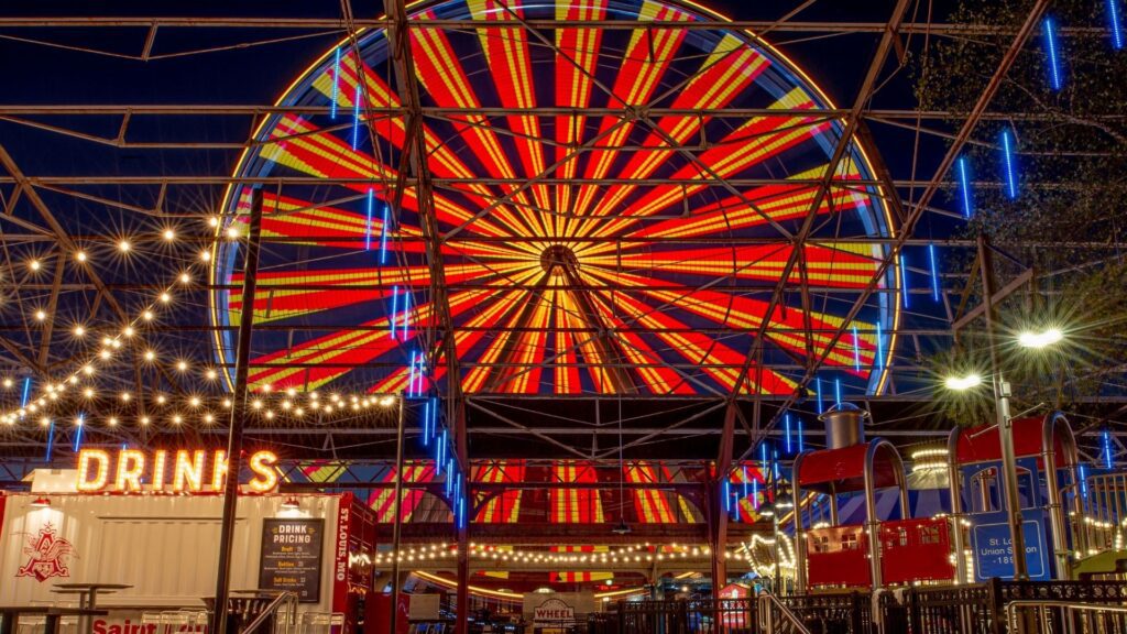 The St. Louis Wheel lights up at night.