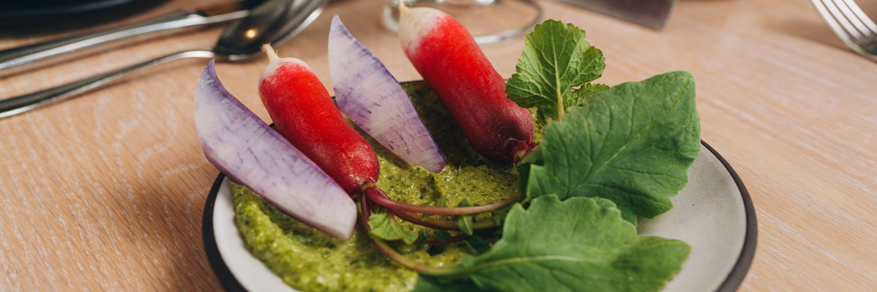The vegetable top pesto at Vicia is served with raw, unadorned vegetables.