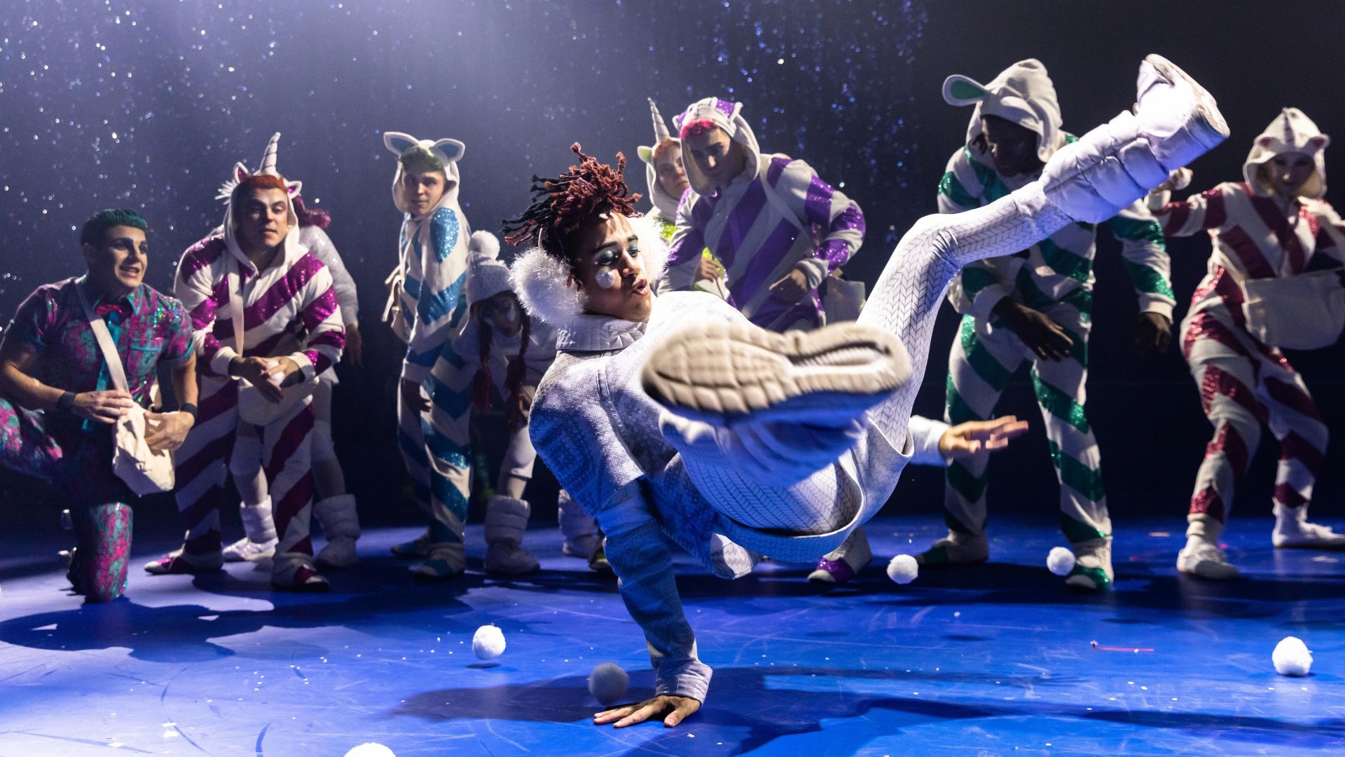 A performer break dances during a performance of ‘Twas the Night Before… by Cirque du Soleil.