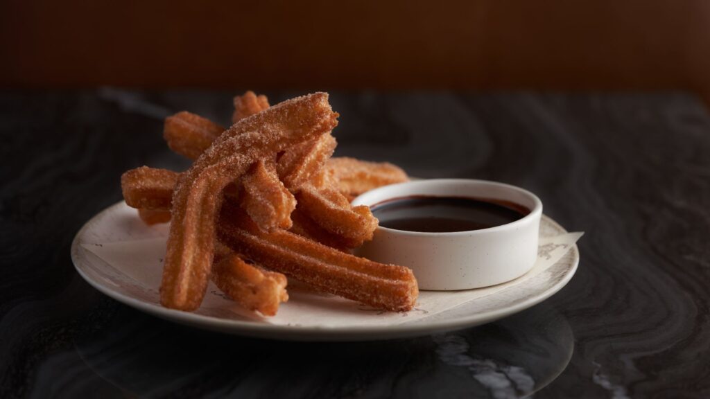 Idol Wolf at 21c Museum Hotel St. Louis serves churros with chocolate sauce, among other Spanish-inspired dishes.