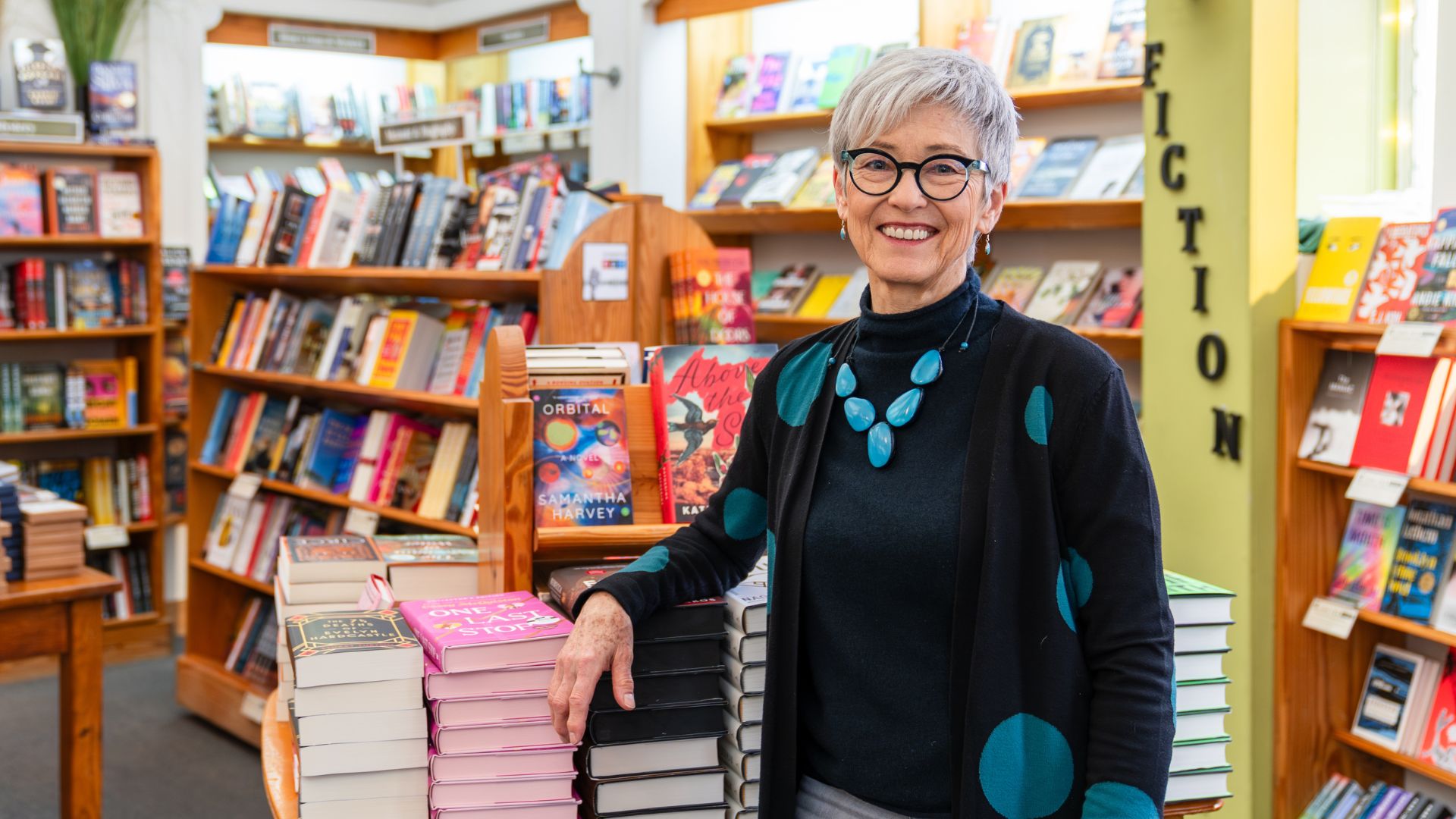 Kris Kleindienst poses in her legendary bookstore, Left Bank Books.
