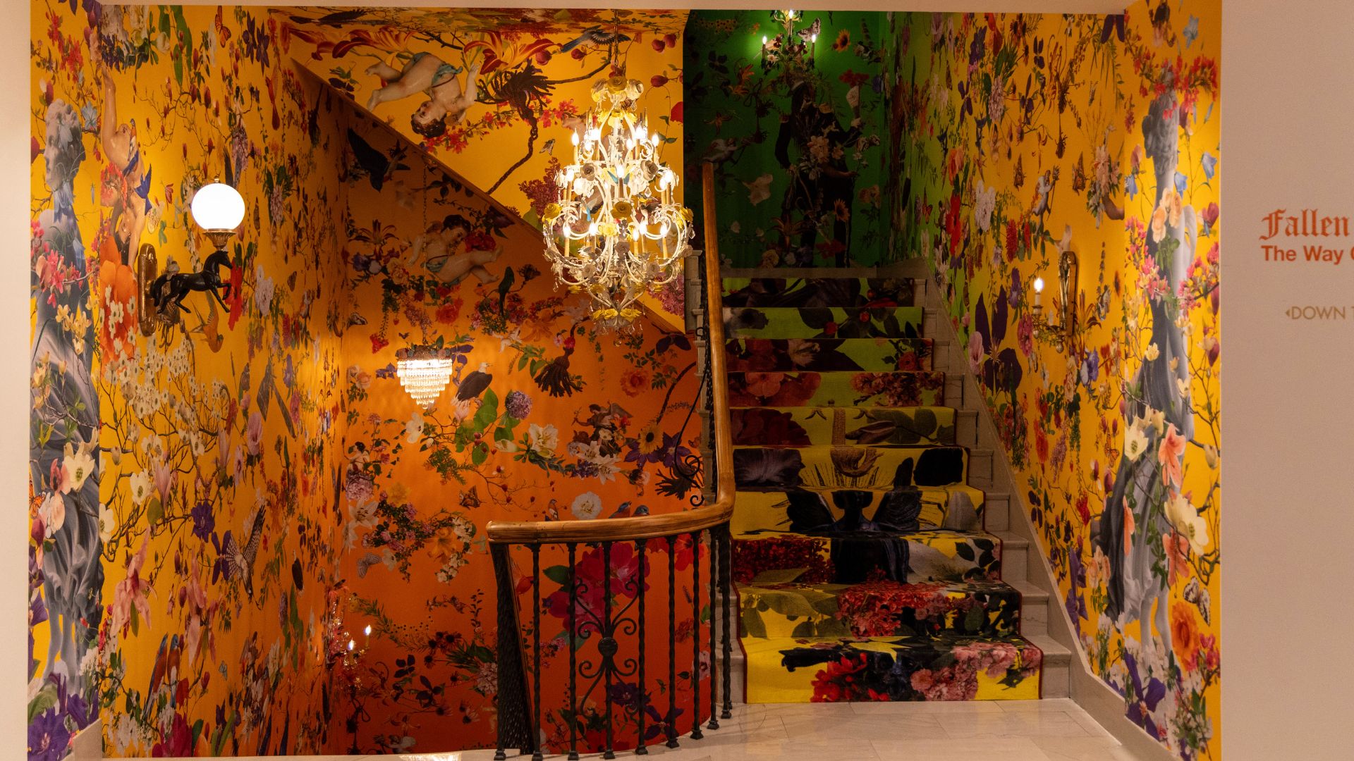 This grand staircase has thousands of stories in the vibrant wallpaper and colorful carpet.