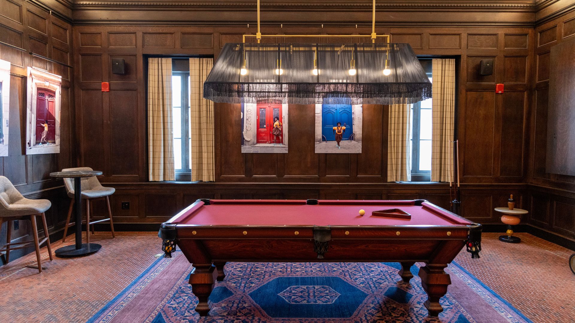 The billiards room at 21c Museum Hotel St. Louis features art by Quinn Antonio Briceño and Yvonne Osei.