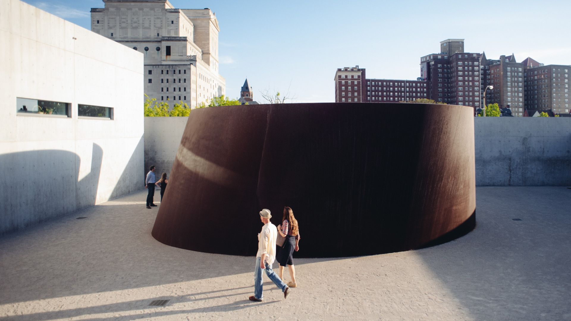 Visitors walk around a permanent outdoor sculpture at the Pulitzer Arts Foundation.