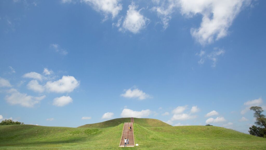 People climb Monks Mound at Cahokia Mounds State Historic Site.