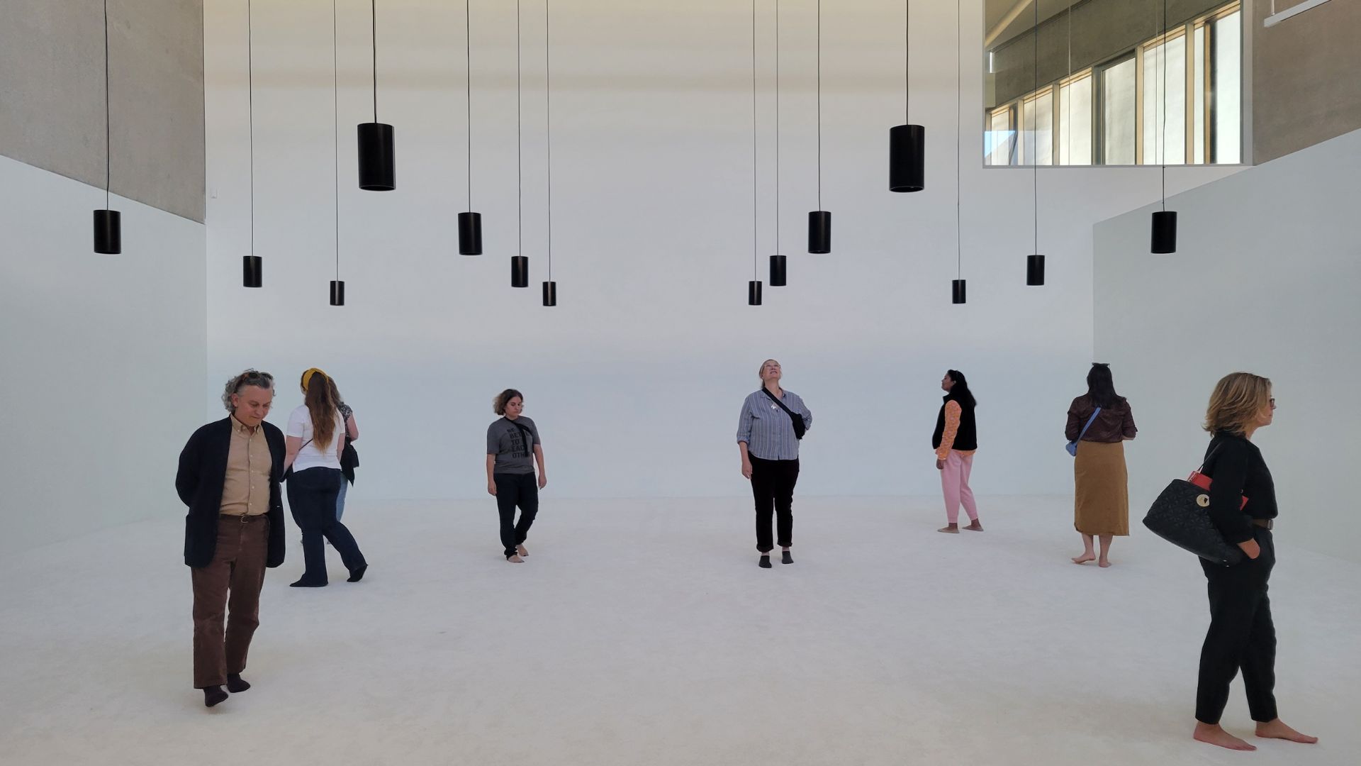 A group enjoys Hajra Waheed's sound piece at the Contemporary Art Museum St. Louis.