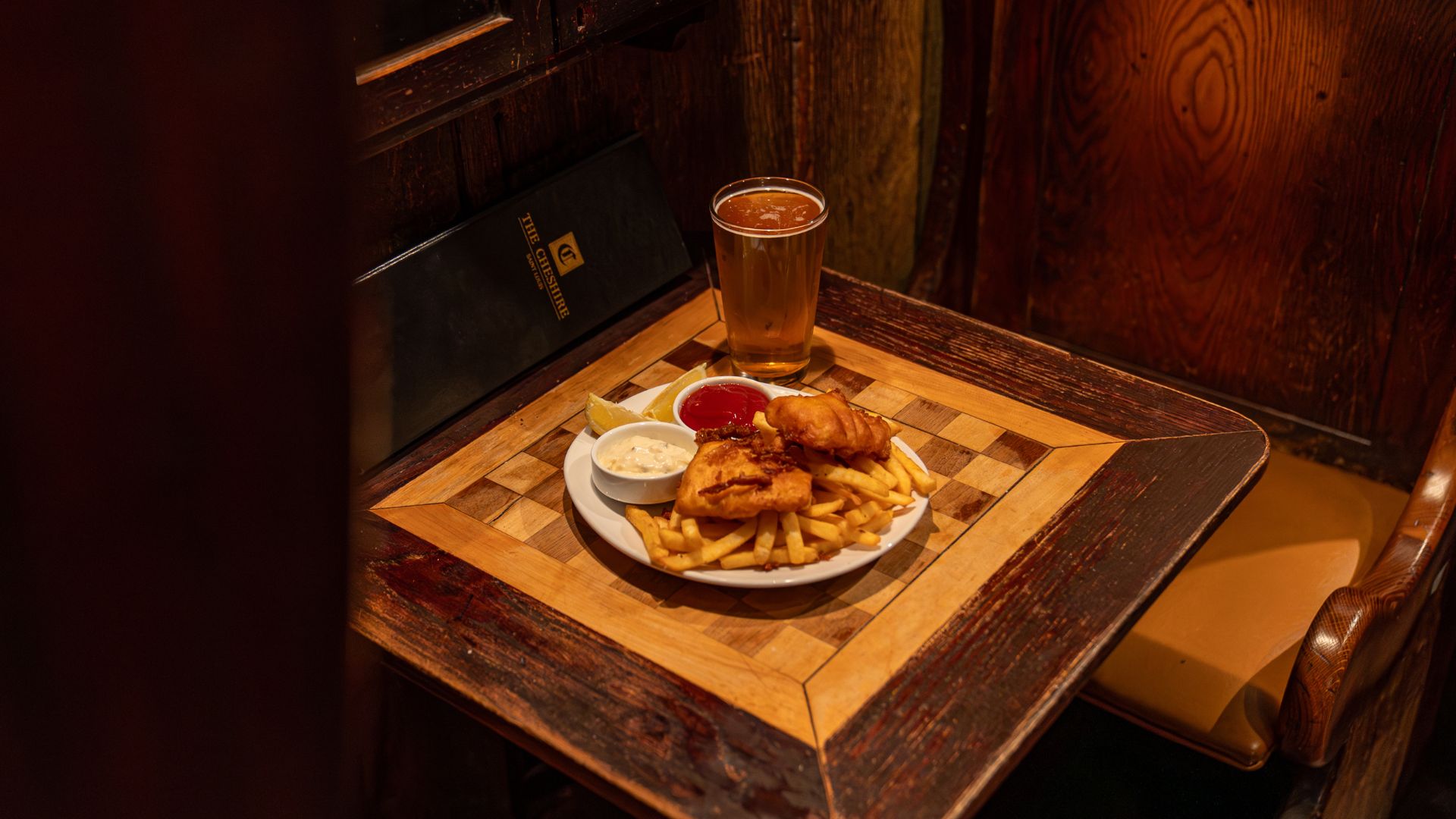 Fox and Hounds is a cozy English pub in Clayton that serves fish and chips and beer.