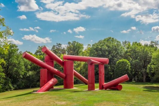 The Way, an outdoor sculpture at Laumeier Sculpture Park, features giant red cylinders.