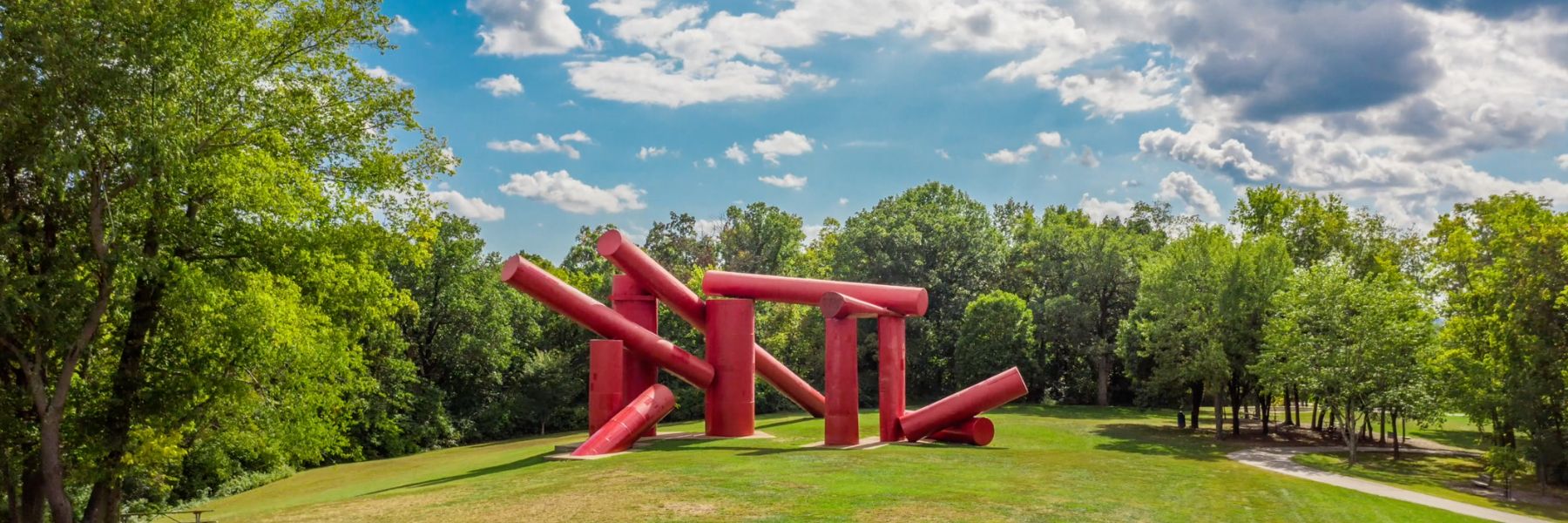 The Way, an outdoor sculpture at Laumeier Sculpture Park, features giant red cylinders.
