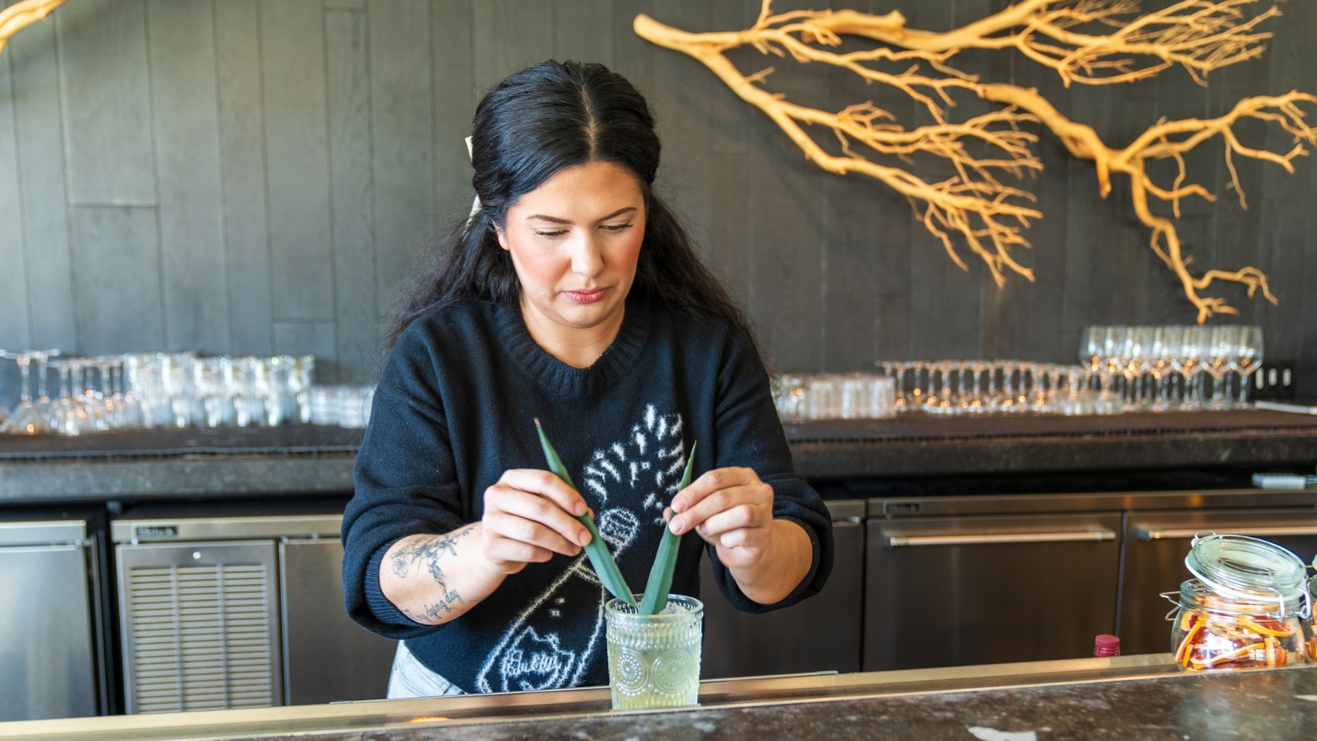 Bar director Leila Miller adds the finishing touches to a cocktail at Vicia.