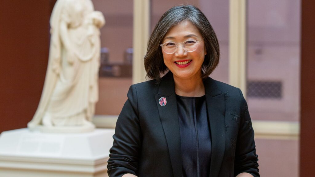 Min Jung Kim, the Barbara B. Taylor Director of the Saint Louis Art Museum, poses in a gallery.