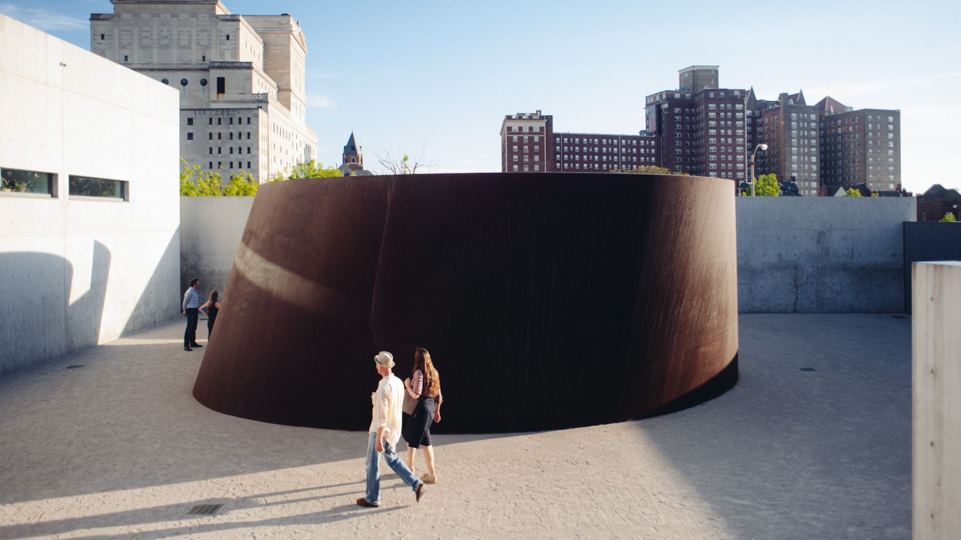 People walk around a permanent outdoor sculpture at the Pulitzer Arts Foundation.