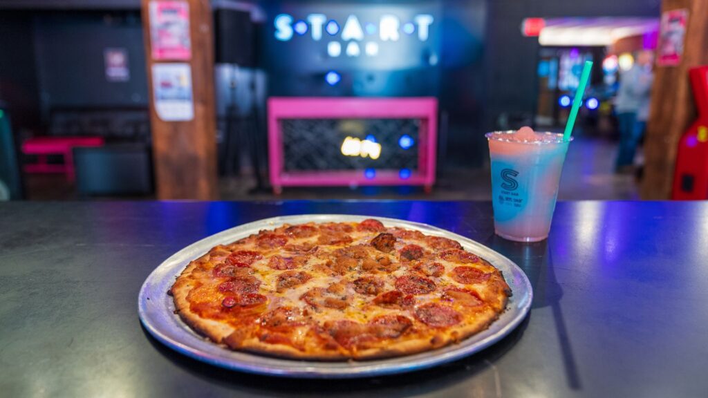 In between games, patrons of Start Bar can enjoy pizza and cocktails.