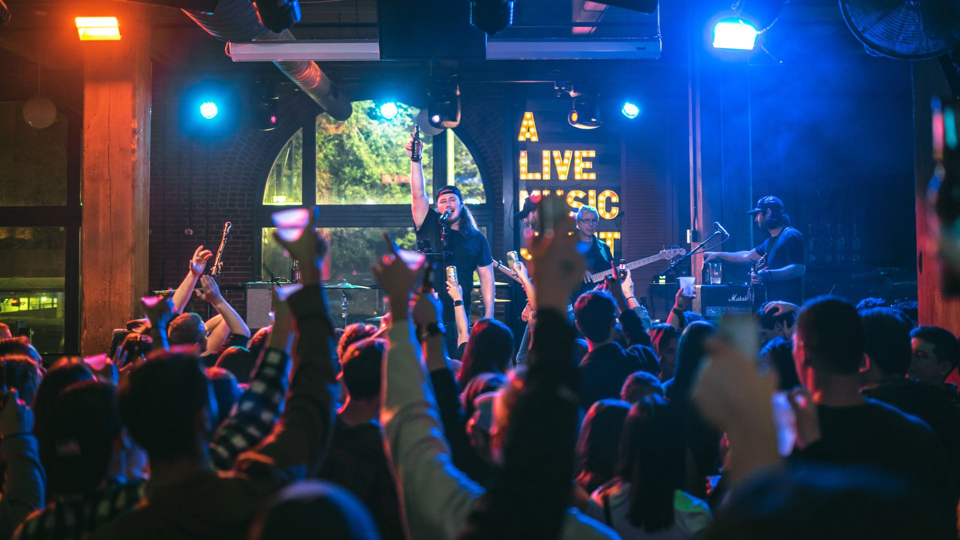 People dance to live music at Tin Roof in downtown St. Louis.