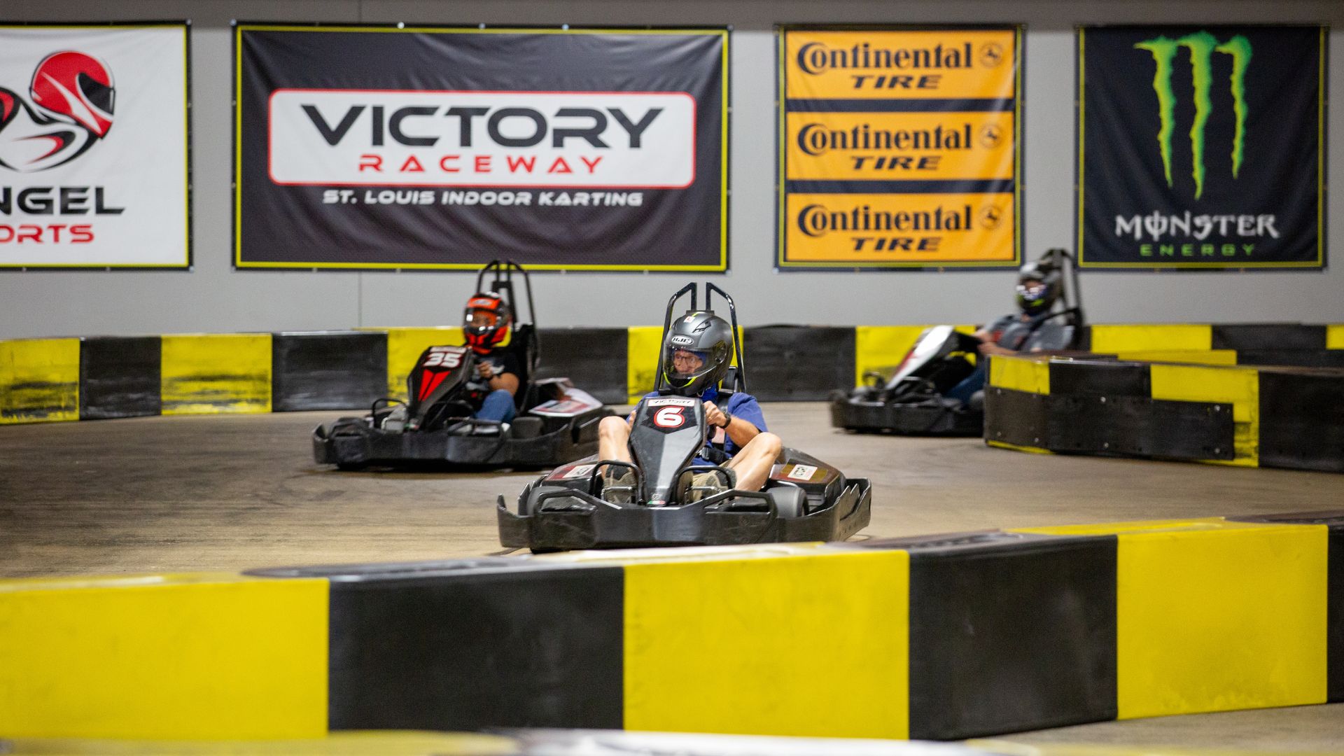 People drive electric go-karts at Victory Raceway in St. Louis.
